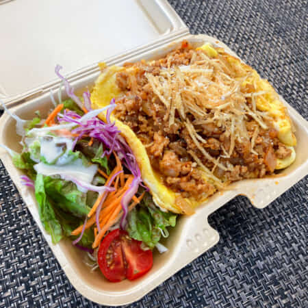 12月限定　ふわふわたまごの幸むすび流オムタコライス｜北九州市・小倉北区で鉄板焼きのお弁当のテイクアウト・デリバリーなら幸むすび